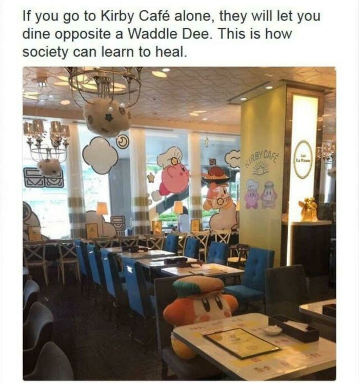 A Waddle Dee plush sits at a table in the Kirby Café, ensuring no one dines alone. This wholesome pic is healing!
