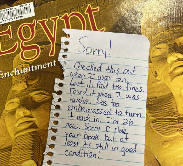 A wholesome pic of a library book titled Egypt, returned with a note apologizing for keeping it for 16 years.