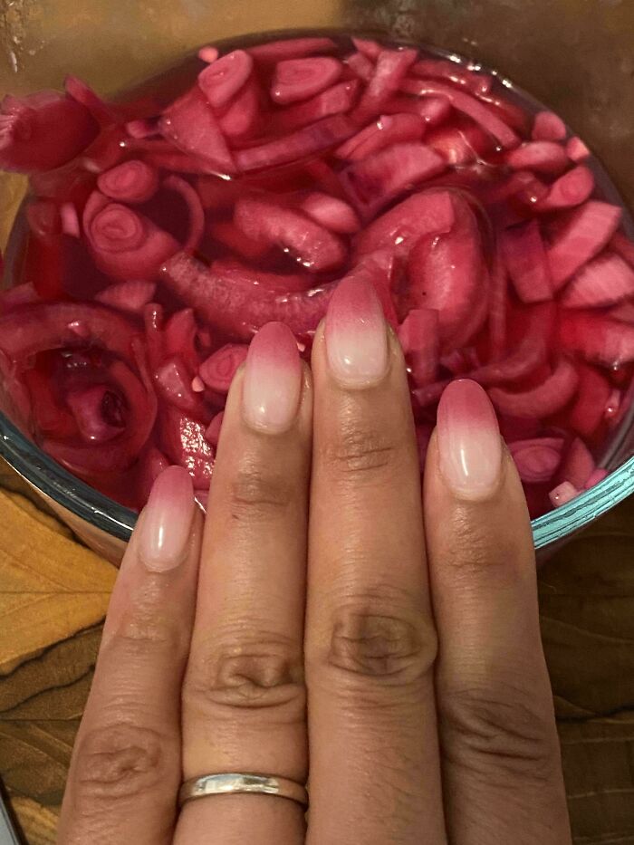 Accidental color match: ombre pink nails perfectly complementing a bowl of pickled red onions, lowering cortisol levels.