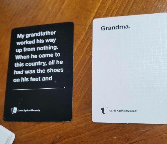 Cards Against Humanity game showing a humorous fill-in-the-blank card about a grandfather and the answer card, Grandma. Wholesome pics.