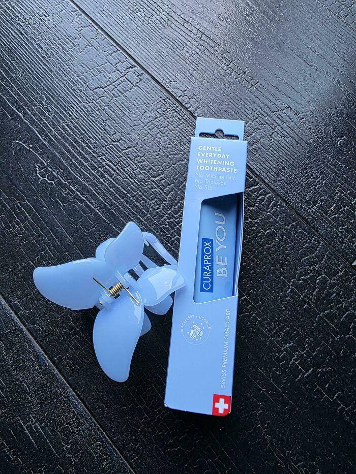 A blue hair claw and a box of Curaprox toothpaste, an accidental color match that may lower your cortisol levels.