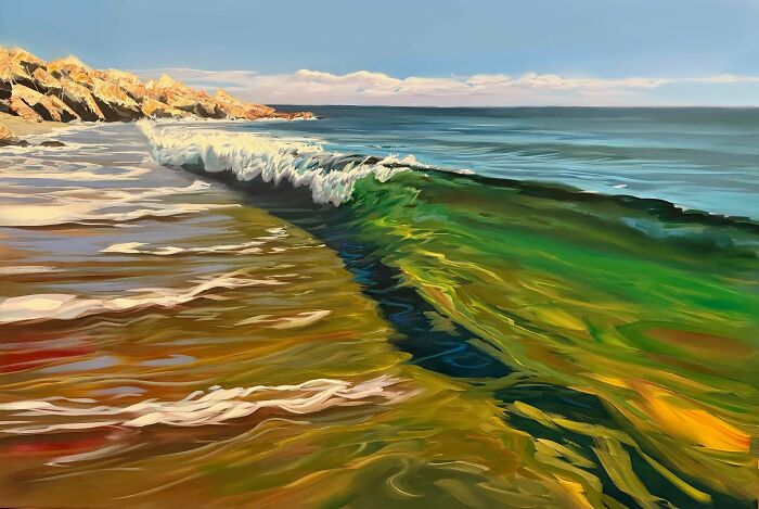 A captivating painting of a handmade project, depicting ocean waves crashing on a sandy beach.