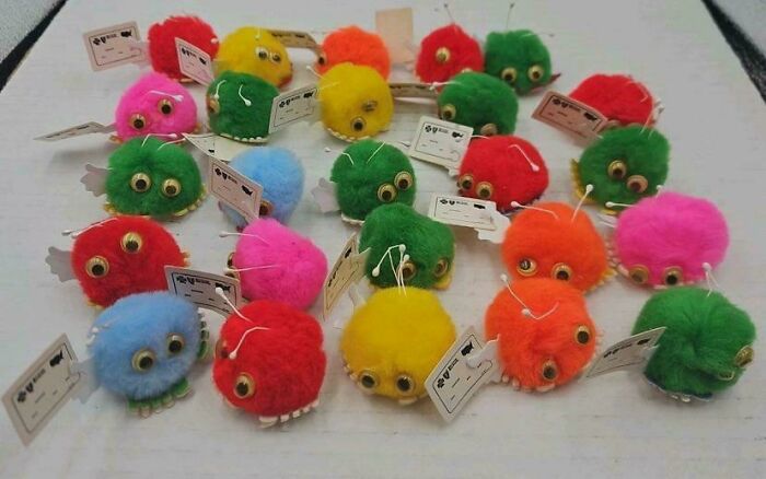 A collection of colorful furry toys with googly eyes, a nostalgic item only 90s kids will understand.