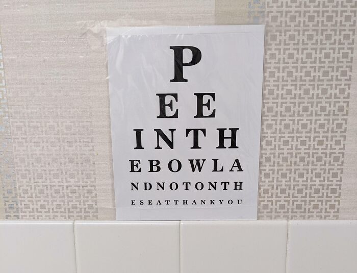 Eye chart styled sign in a bathroom with humorous text, a perfect example of doctors awesome sense of humor.
