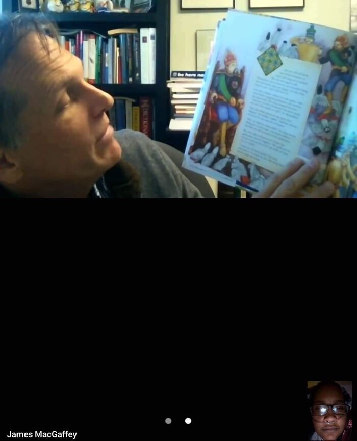 A man reading an illustrated book, likely sharing a funny story, showcasing doctors awesome sense of humor.