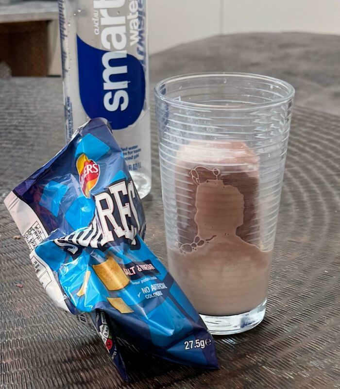 Pareidolia chocolate drink residue inside glass forms human silhouette