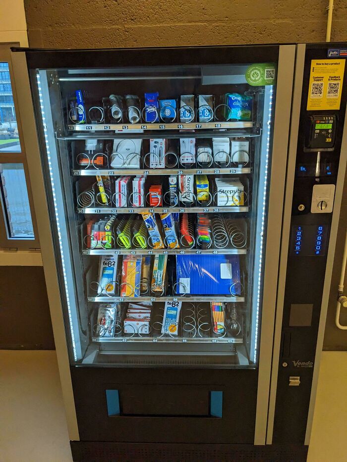 School vending machine stocked with supplies including calculators and notebooks