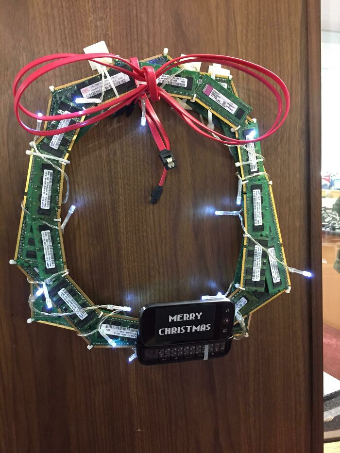 Christmas wreath made of computer RAM sticks with holiday lights and greeting