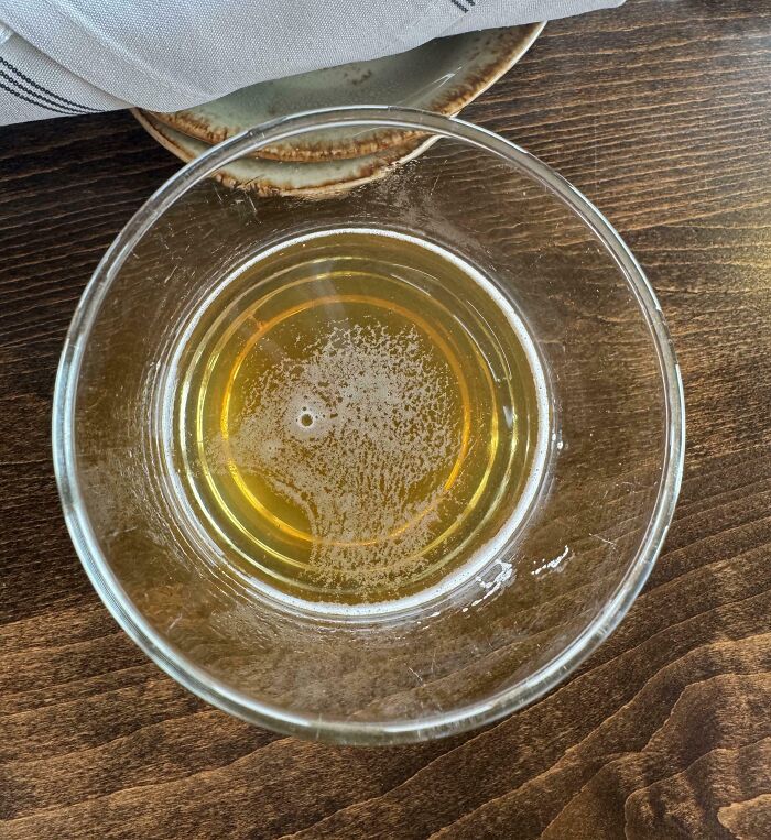 Pattern in drink resembling a face demonstrating pareidolia
