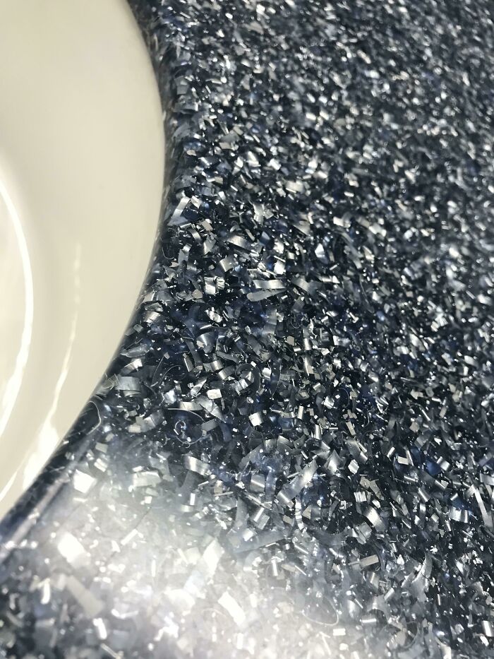 Close-up of sparkling textured surface near university sink