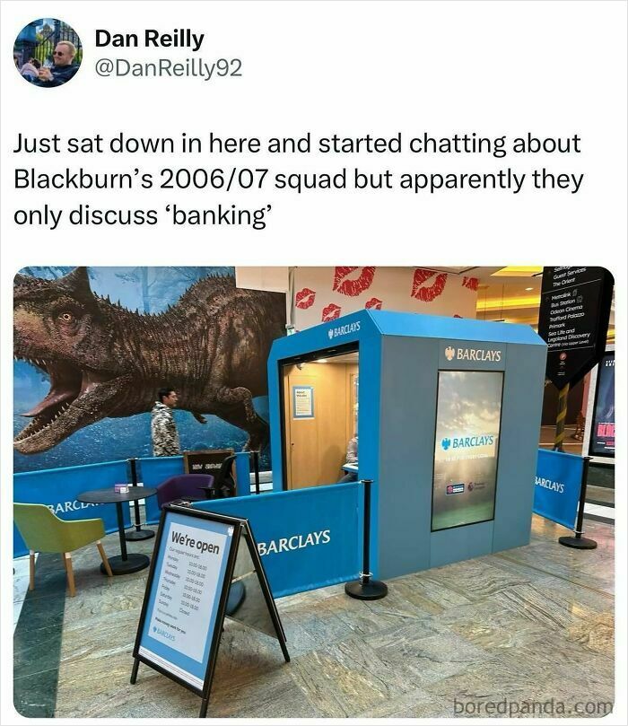 A British meme showing a Barclays banking booth with seating and a huge dinosaur backdrop.