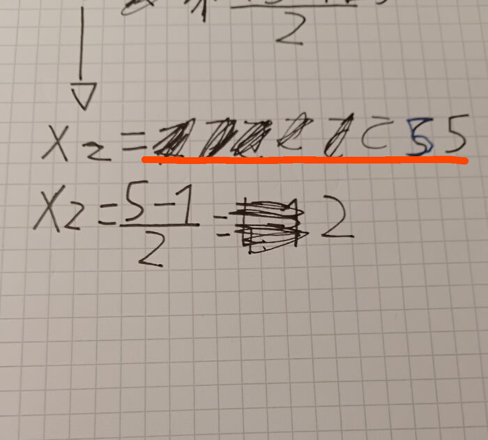 Math equation with multiple crossed-out corrections on graph paper