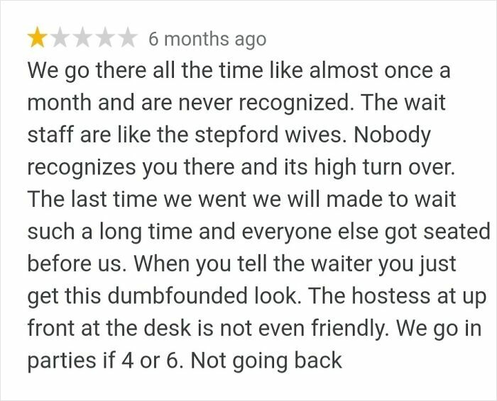 Angry customer review describing poor service and unfriendly staff at a restaurant