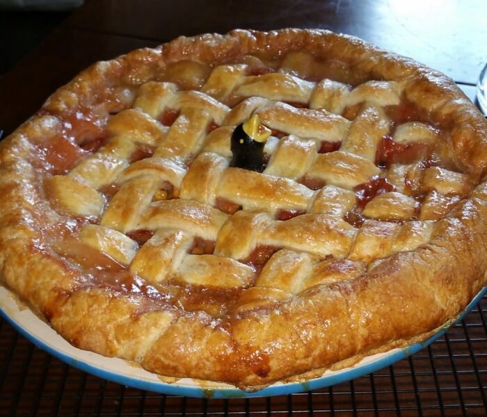 A freshly baked fruit pie with a golden lattice crust, perfect for last minute Mother's Day gifts.