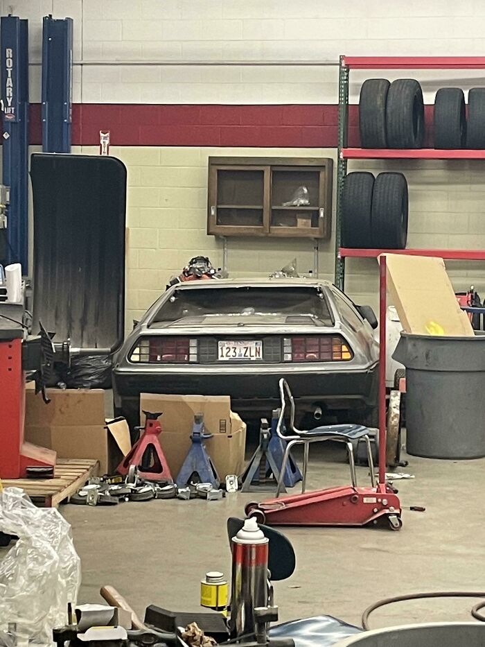 Classic car restoration project inside a school's automotive workshop