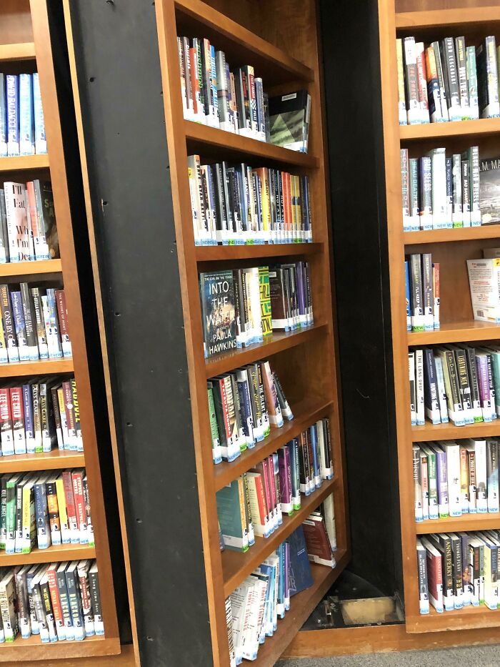 Hidden library bookshelf with books and a secret compartment in a school