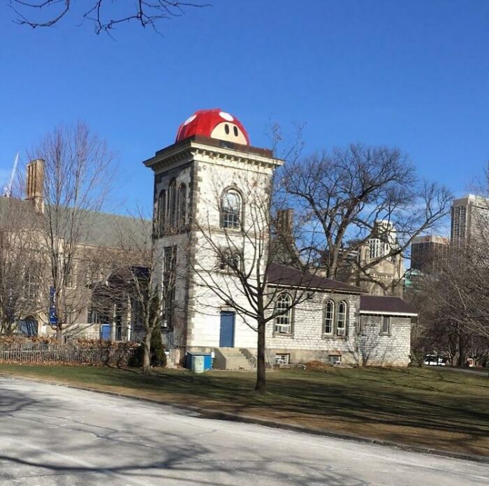 University building with a large Mario-themed mushroom decoration on top