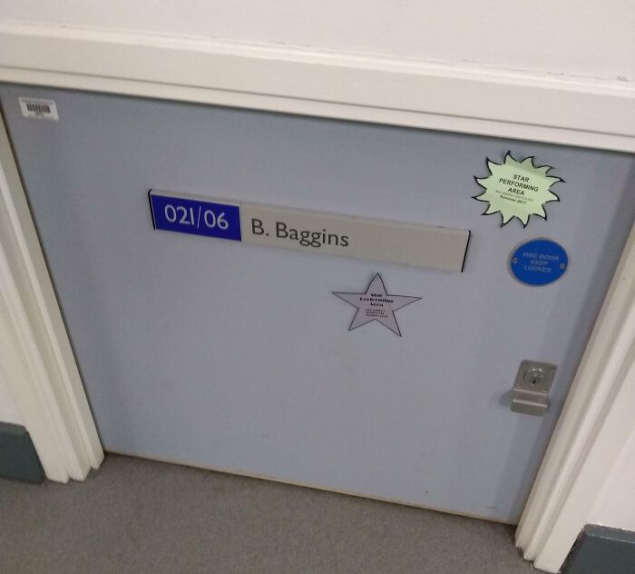 Classroom door labeled B Baggins with star stickers in school hallway