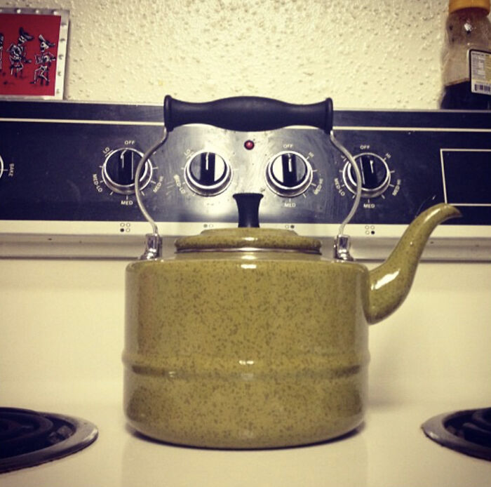 Kettle and stove dials create a face illusion in a pareidolia image