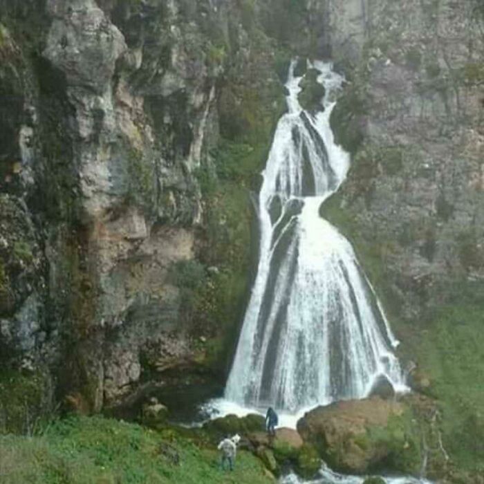 Waterfall shaped like a woman in a dress pareidolia