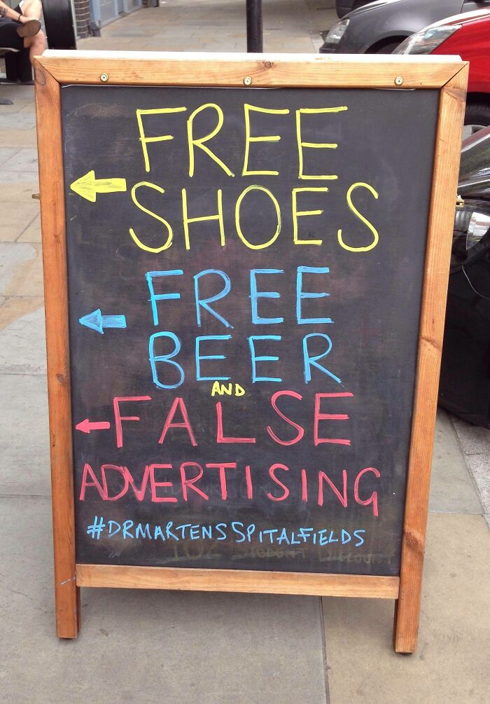 Witty British sign with free shoes, beer and false advertising