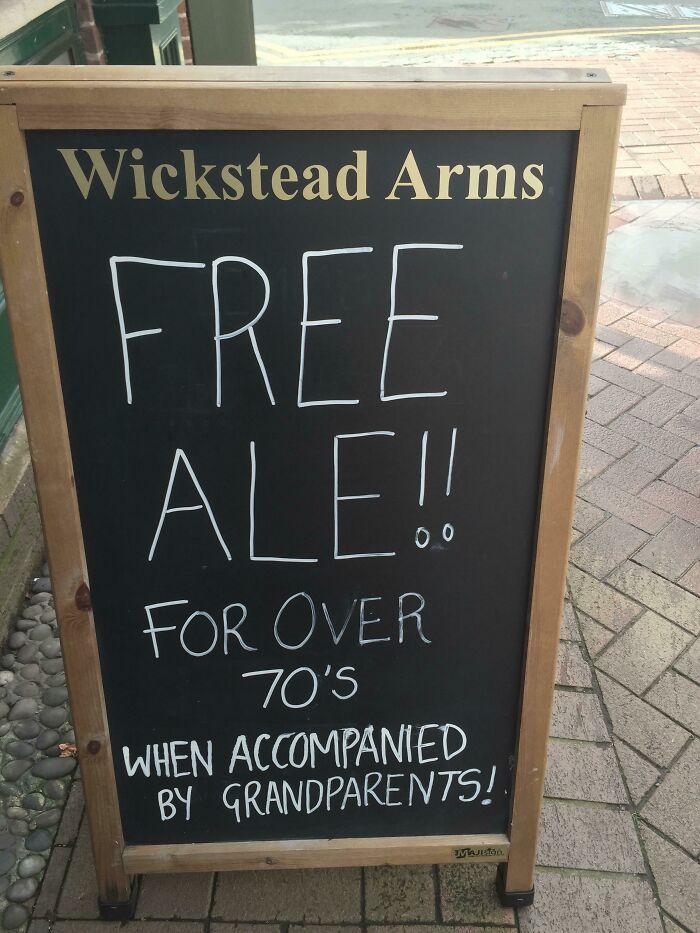 British pub sign offering free ale for over 70s with grandparents