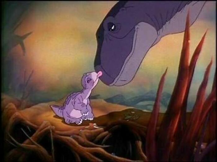 Littlefoot and his mother from The Land Before Time, a beloved movie for 90s kids.
