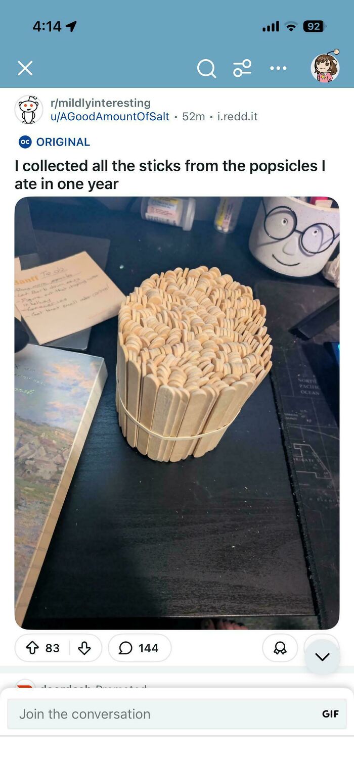 Large bundle of collected popsicle sticks from one year on a desk