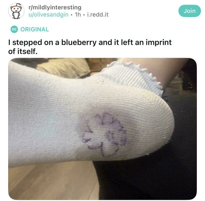 Socked foot with imprint of blueberry leaving unique pattern unusual interesting fake