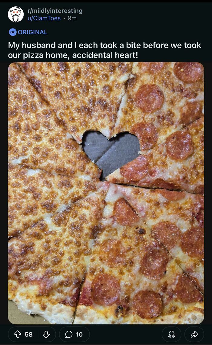 Pizza with accidental heart-shaped bite taken out mildy interesting fake internet points