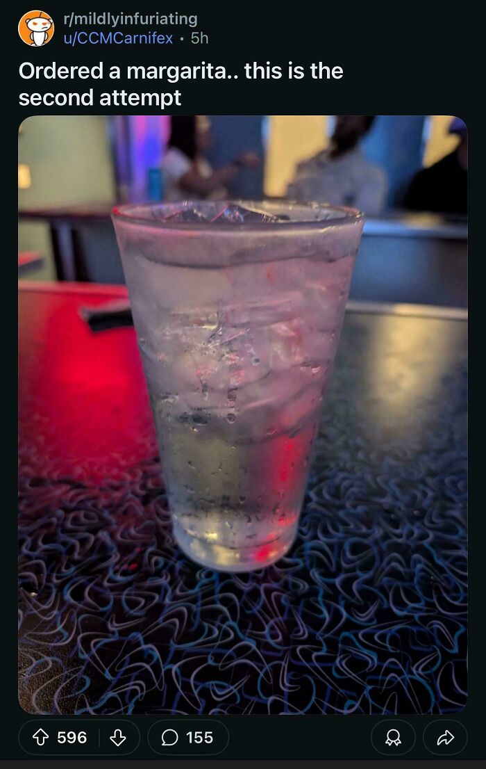 Glass of water mistaken for margarita drink on bar table