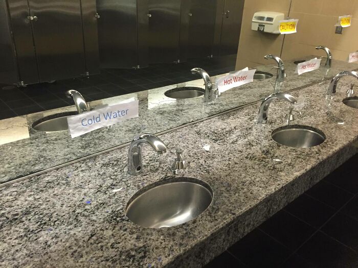 Bathroom sinks with confusing cold water and hot water labels placed inconsistently