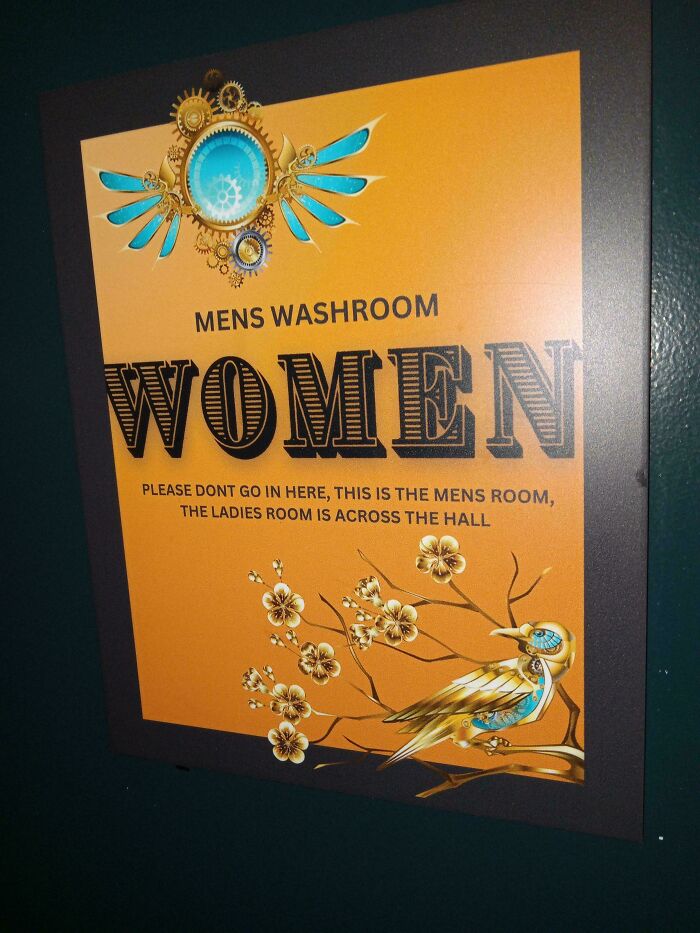 Confusing womens sign on mens washroom door with decorative bird and floral design