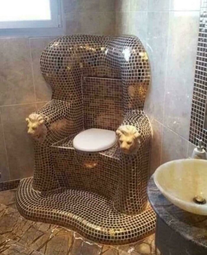 Lavish lion-themed toilet chair with intricate tile design