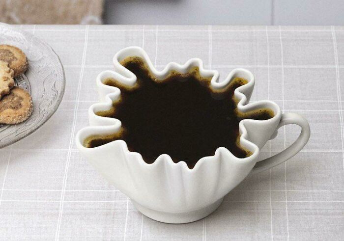Coffee cup shaped design mimicking spilled coffee pattern