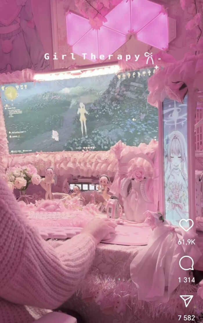 Pink gaming setup with cluttered desk and pink computer accessories