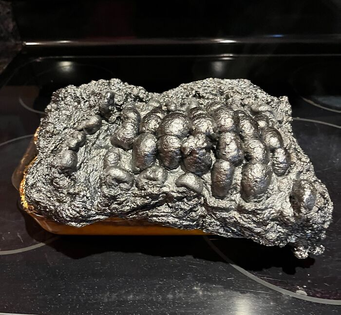 Burnt kitchen loaf with overcooked ruin turned black and bubbled