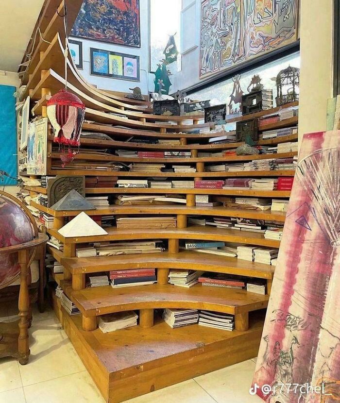Creative wooden bookshelf staircase design with integrated book storage