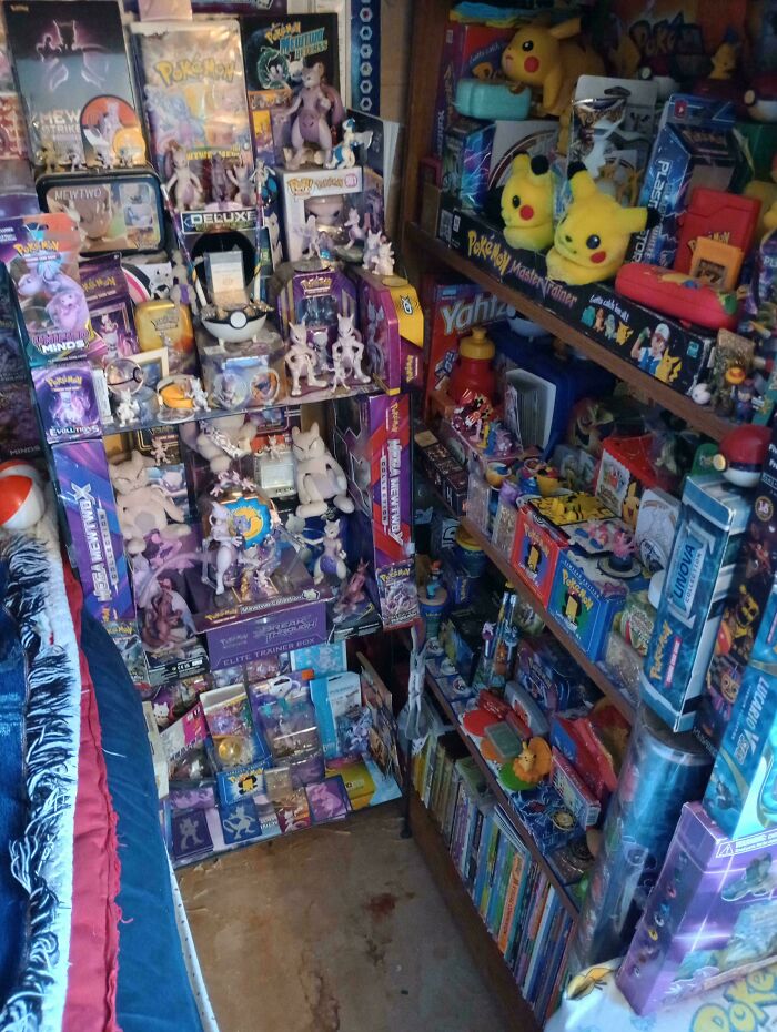 Room filled with assorted Pokemon toy collection and packaging