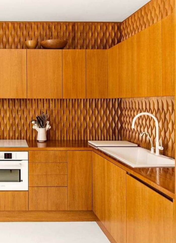 Wooden kitchen cabinetry with textured surfaces hard to clean