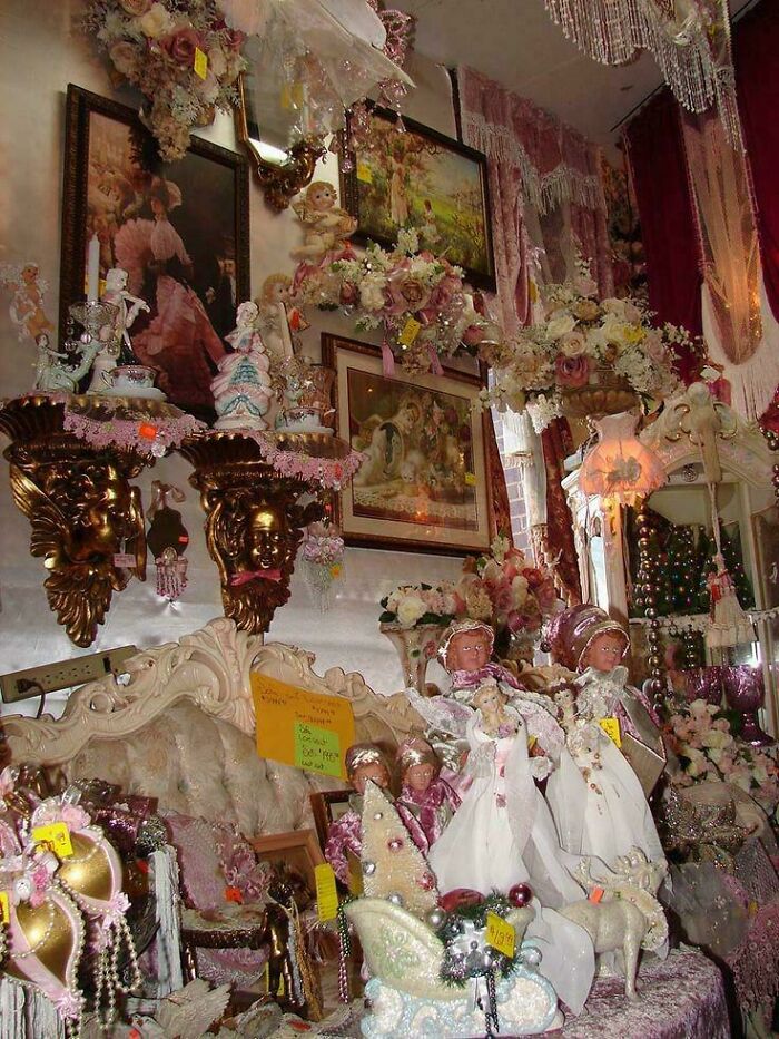 Overcrowded vintage decor items and dolls filling a room with complex designs