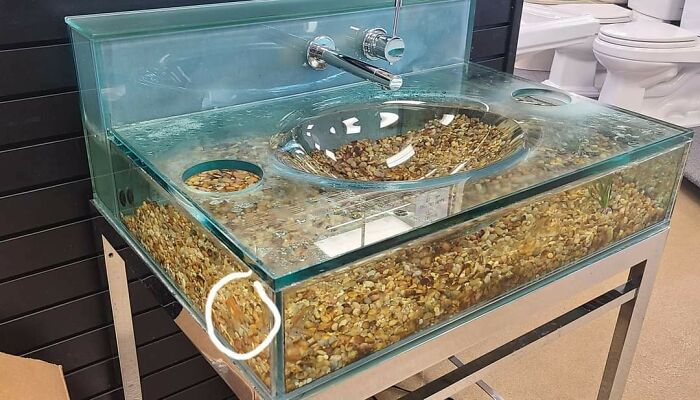 Glass sink filled with gravel making cleaning difficult