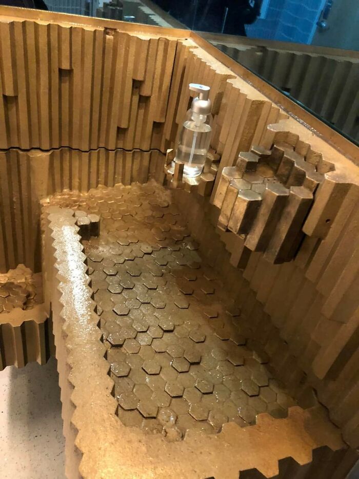 Wooden design shaped like a pool with soap dispenser, dirty surface