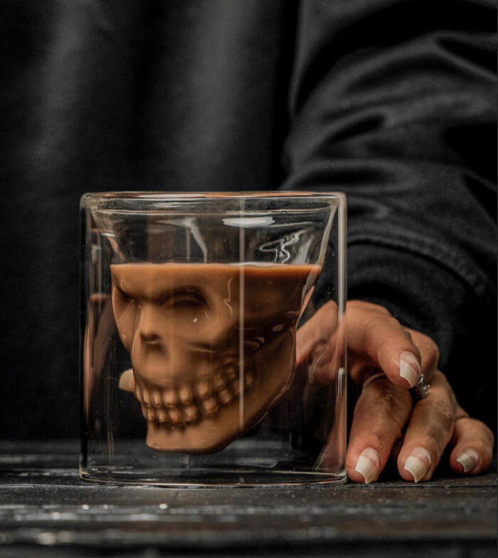 Chocolate skull shape in glass mug showcases unique themed drinkware design