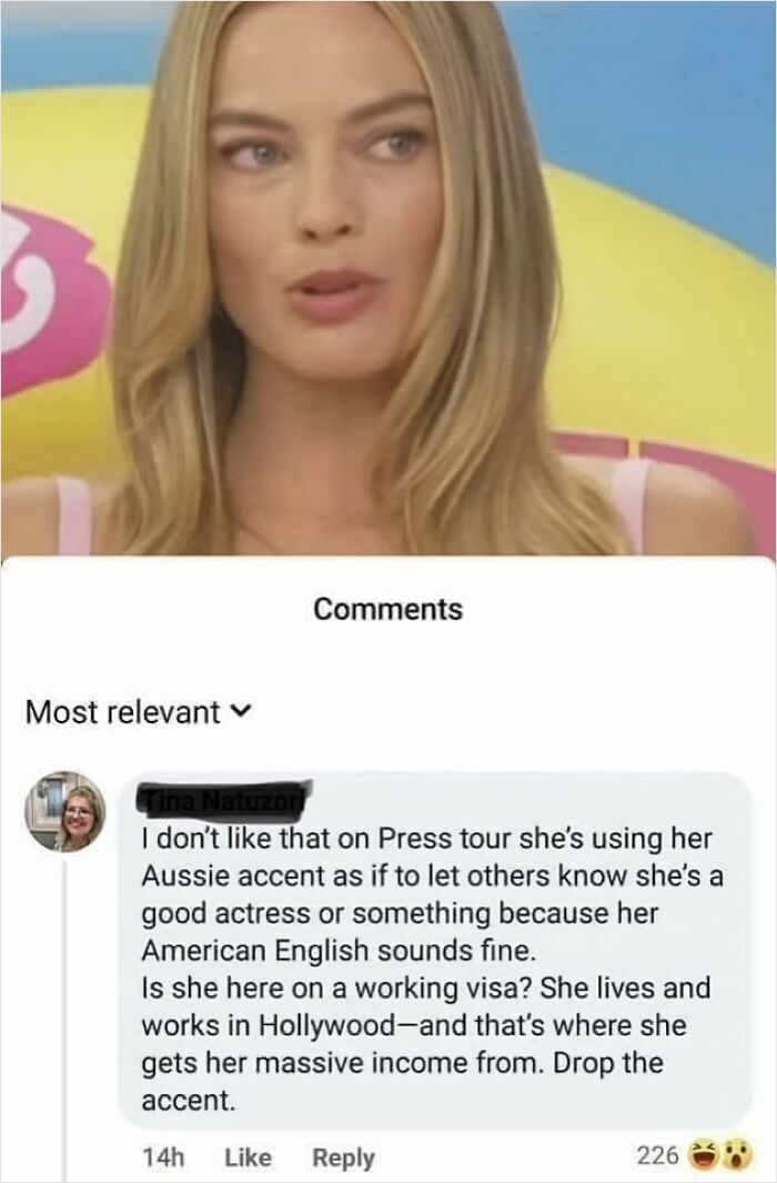 Woman with blonde hair reacting to comment about using Aussie accent on press tour