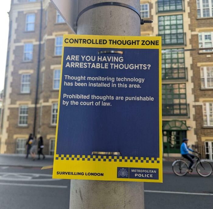 Funny British sign about controlled thought zone and punishable thoughts by law