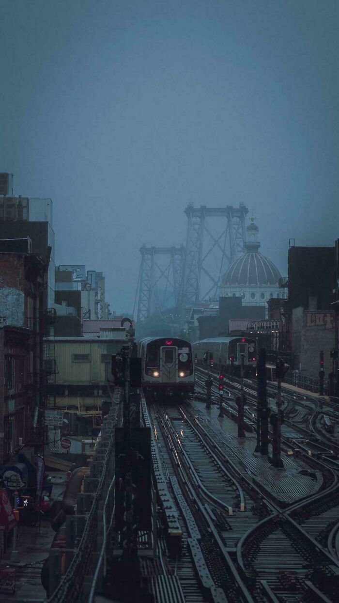 Foggy urban hell subway trains and bridge in gloomy city