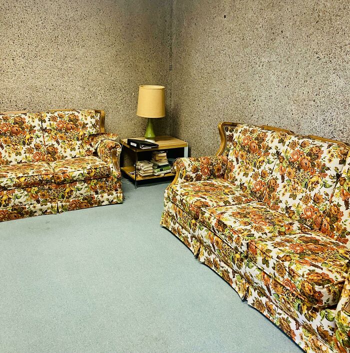 Two floral couches and a lamp evoke a time machine to older times, perfect for retro pics.