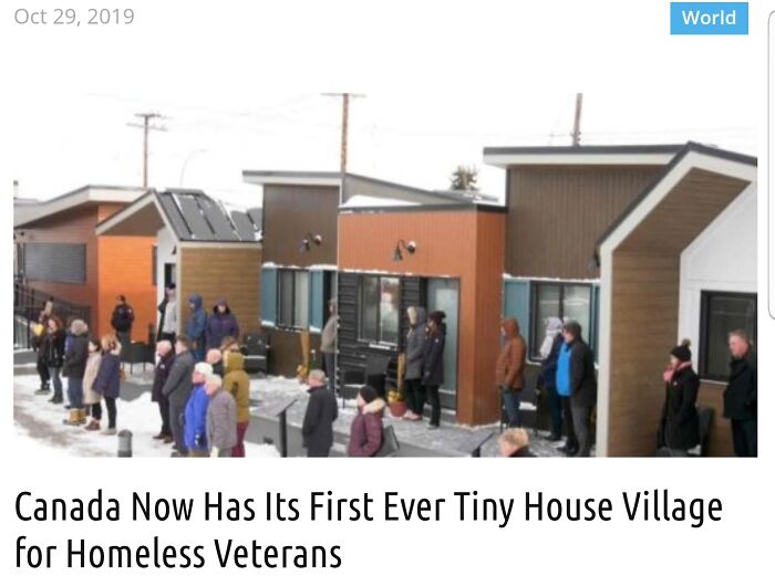 Blessed Images of people standing in front of new tiny houses for homeless veterans, creating positivity.