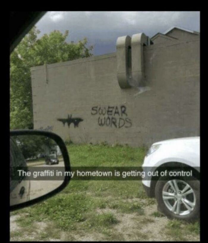 A humorous image of graffiti on a wall, depicting a bat symbol and the words SWEAR WORDS, offering positivity.